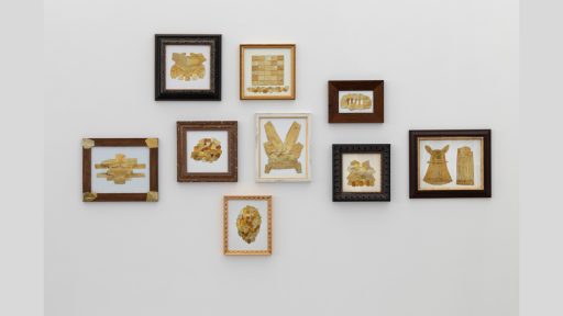 A series of framed images on a wall, each showing gold objects