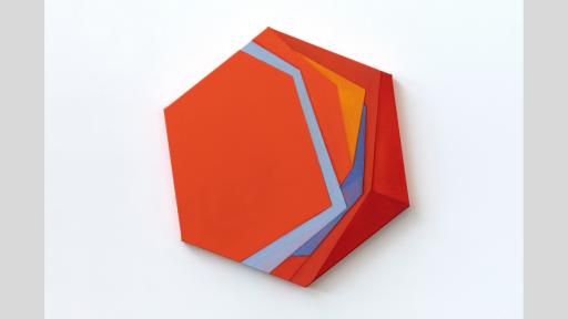 A hexagonal canvas painted to show a stack of shapes in oranges, blues, and reds.