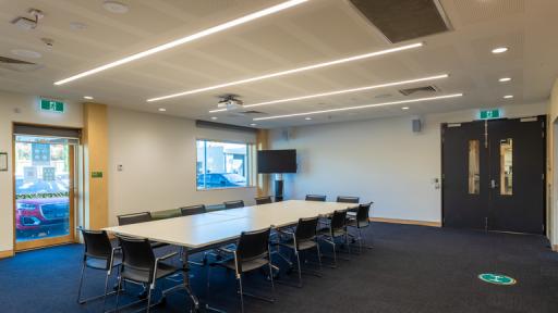 A meeting room with a boardroom table