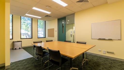 A small meeting room with whiteboard