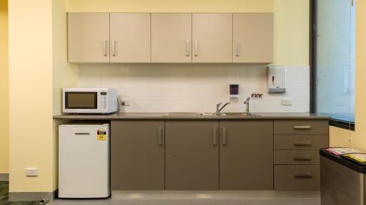Kitchenette with microwave and sink