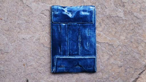 Ceramic artwork resembling a jeans pocket