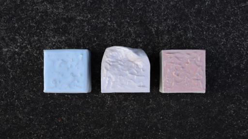 A ceramic artwork of 3 textured, coloured cubes