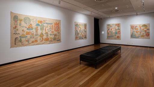large drawings like hieroglyphs on 2 gallery walls