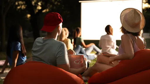 People watching a movie at an outdoor cinema
