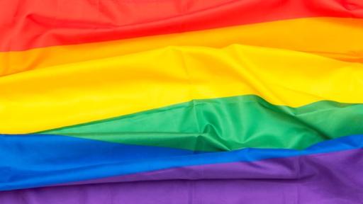 Closeup of a billowing rainbow Pride flag