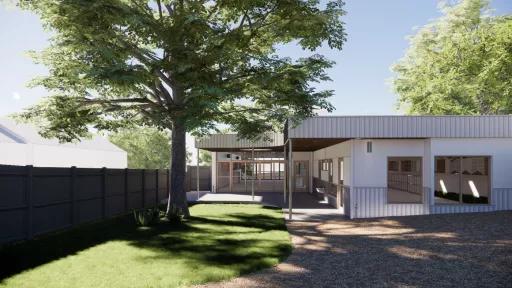Artists impression of the outdoor play area at the JJ McMahon kindergarten, with shaded areas along the building, a grassy area with a large tree, and a tanbark area