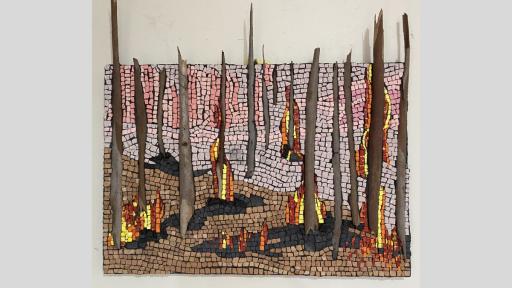 An artwork featuring a mosiac that epicts a dry australian landscape that is on fire, with wooden sticks between the mosaic tiles to represent trees