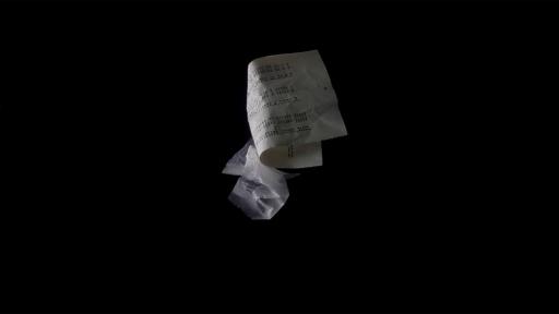 Single pieces of crumpled paper and plastic floating against a black background.