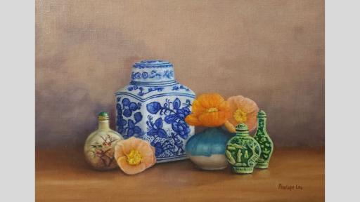 A still-life painting of a collection of objects on a wooden surface before a brown wall. From left to right, the objects are a small, round, beige vessel with a green lid and painted flowers on the front, an orange poppy without a stem, a large white ceramic container with a lid with painted blue flowers, a small round blue and white vase with two orange poppies, and two small green vessels with lids embossed with a garden scene.