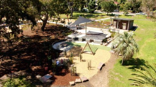 Aerial view of playground area including a climbing frame and sandpit