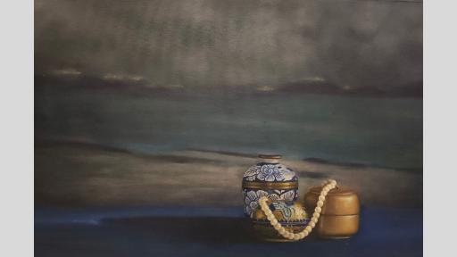 A still-life painting of a collection of three decorative containers on a blue surface before a grey and blue landscape. One container is blue with gold detailing and white flowers, the other two are gold. A string of pearls is draped across the two gold containers. 