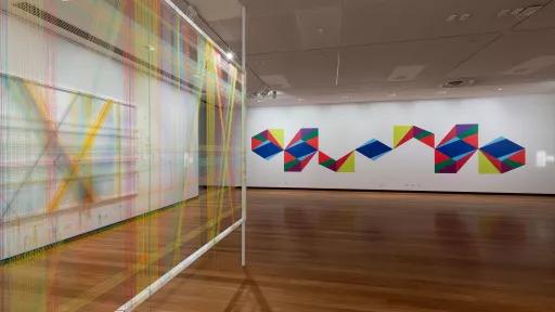 Photo of mixed media work in a gallery.