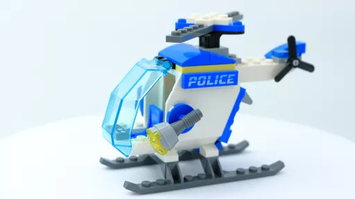 Lego constructed helicopter, white and blue in colour with police wording displayed on side