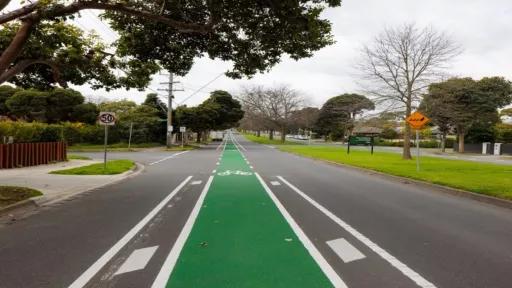 A green-painted bike lane on a local street