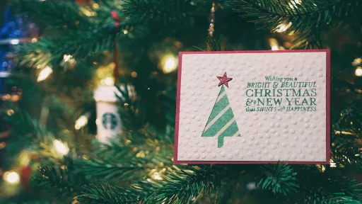 Christmas card hanging from tree