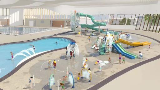 Artist render of a spacious indoor water play area with slides, sprays and small pool