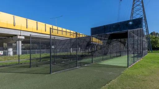 3 cricket net lanes on synthetic grass.