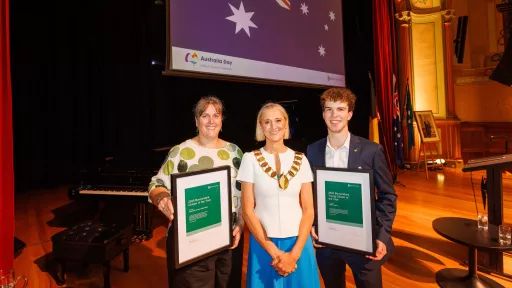 Citizens of the Year Reverend Natalie Dixon-Monu and Angus Aikman standing either side of Mayor Torney and holding their certificates.