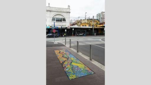 looking towards glenferrie road, a colourful mosaic featuring smiling people, buildings and green hills