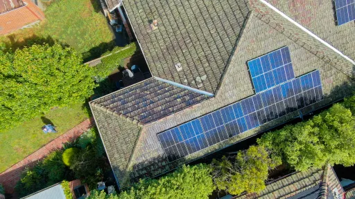 An array of solar panels on a tiled roof