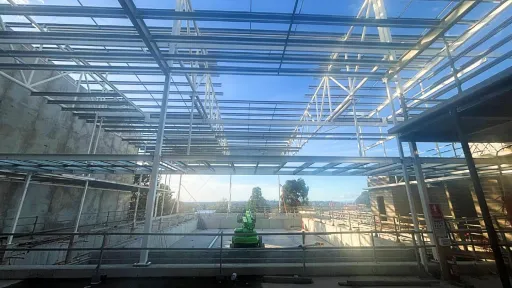A half built structure with steel frames and beams