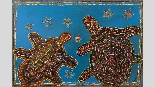 A painting of two turtles depicted in dot painting style with concentric patterns in red, yellow, white, and green on a blue background. Smaller turtles surround them, and a dotted border frames the composition.