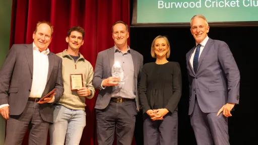 3 men from Burwood Cricket Club hold plaques from the Mayor