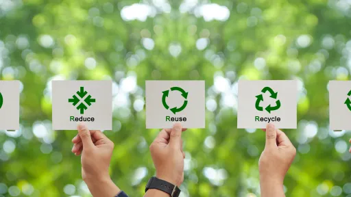 hands holding up signs saying refuse, reduce, reuse, recycle and rot.