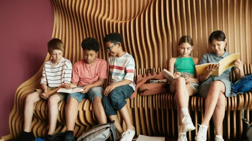 Children are sitting reading books