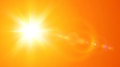 A radiantly hot sun in an orange sky