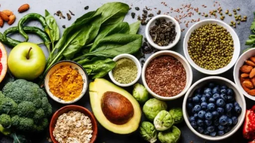 A bunch of healthy fruit and vegetables on a countertop