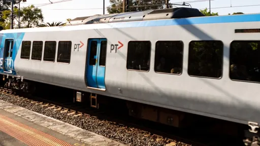 A metro train at a platform in East Camberwell station