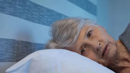 a tired and worried woman rests on a pillow