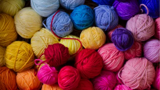 many balls of multi-coloured wool