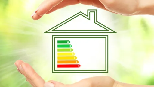A person's hands above and below the outline of a home with letters A to G on coloured strips inside, changing from green at A to Red at G
