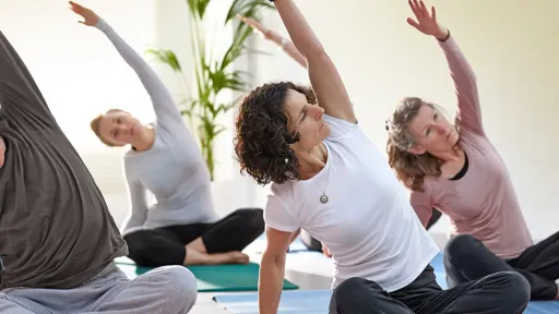 Women doing indoor yoga