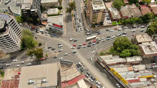 Arial view of Kew Junction, where 5 sections of road come together. There's a mix of multistory and low level buildings.