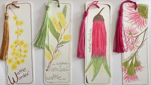 Four bookmarks with coloured tassels sit on a white background. The bookmarks show images of native flowers