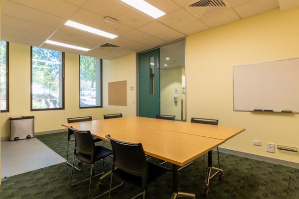 A small meeting room with whiteboard