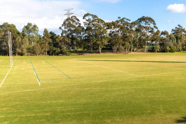A rectangular sportsground featuring rugby goal posts