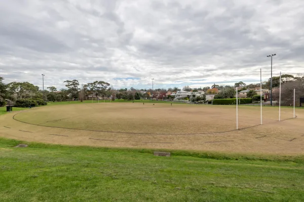 A circular sportsground with AFL goal posts