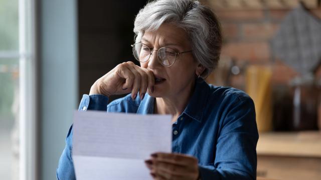 A person reading a letter