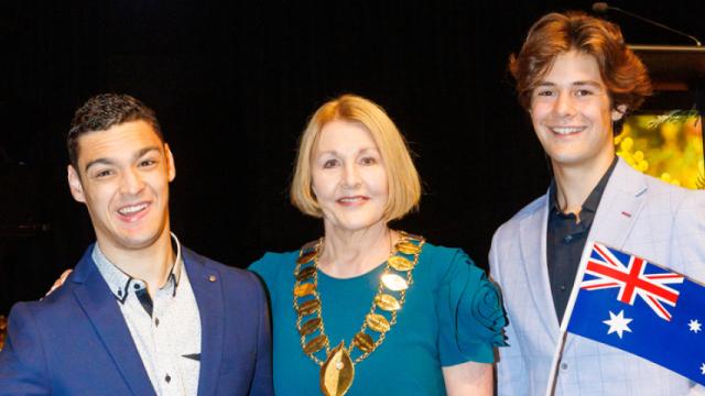Citizen of the Year Brenton Ponza in dark-blue jacket, Mayor Lisa Hollingsworth in green dress, and Young Citizen of the Year Henry Shireffs in light-blue jacket.