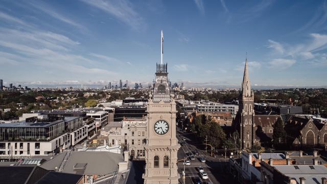 Hawthorn Arts Centre clock tower from above. The Melbourne City skyline is on the horizon