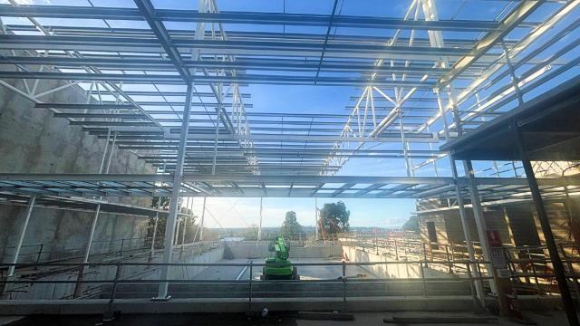 A half built structure with steel frames and beams