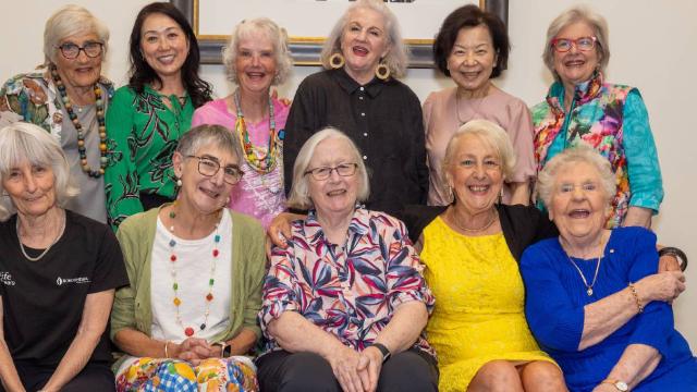 A group shot of 11 older women