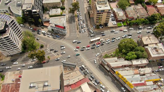 Arial view of Kew Junction, where 5 sections of road come together. There's a mix of multistory and low level buildings.