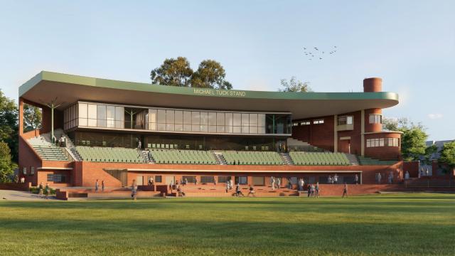 Illustration of brick grandstand named Michael Tuck Stand with green seats and glassed-fronted rooms under roof