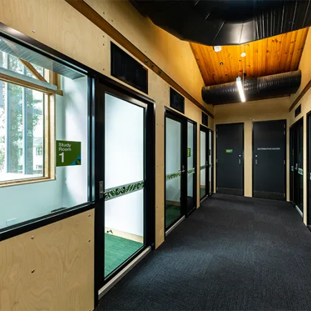Hallway with small study rooms on either side.